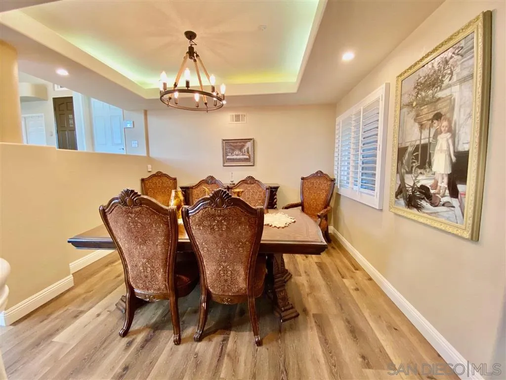 1988 Monarch Ridge Circle El Cajon, CA 92019 - Photo 11 of 27 a view of a dining room with furniture wooden floor and chandelier