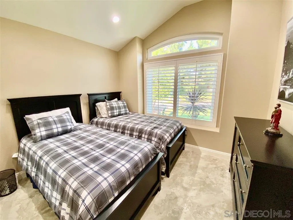 1988 Monarch Ridge Circle El Cajon, CA 92019 - Photo 17 of 27 a bedroom with double bed and a window
