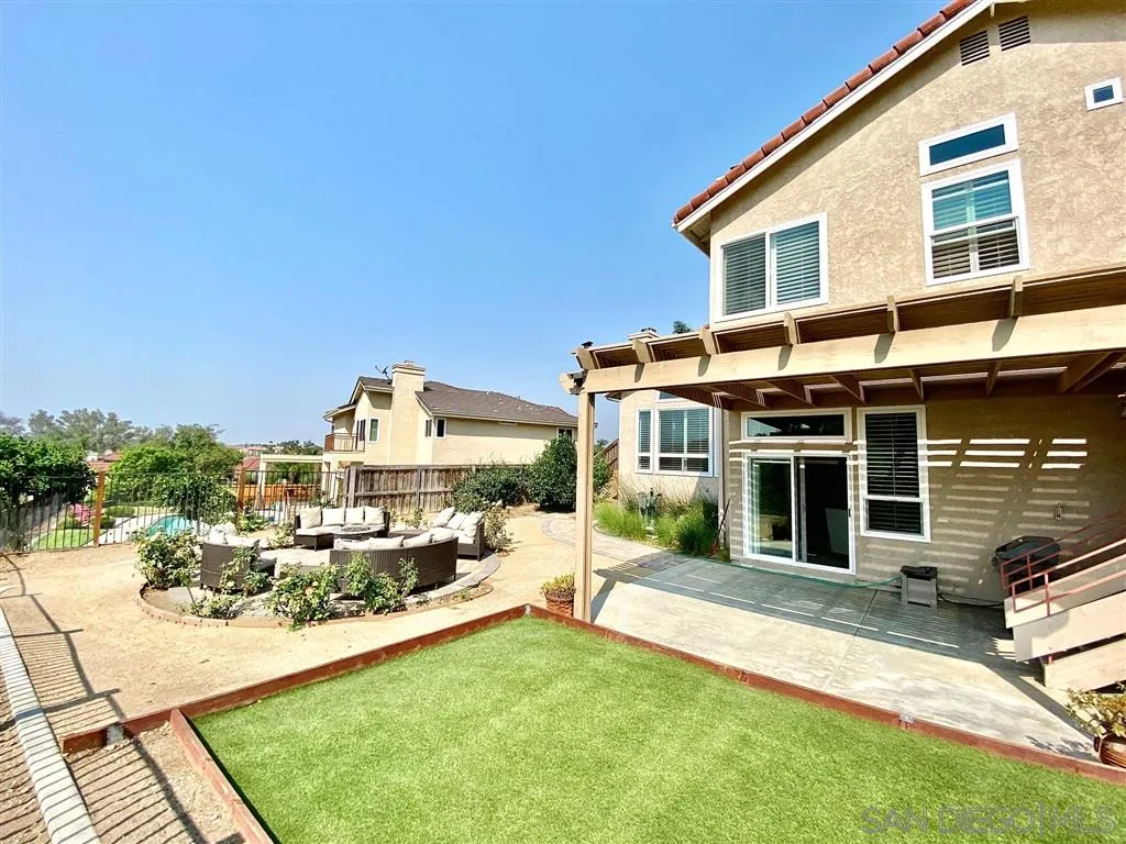 1988 Monarch Ridge Circle El Cajon, CA 92019 - Photo 21 of 27 a view of a house with a yard and sitting area