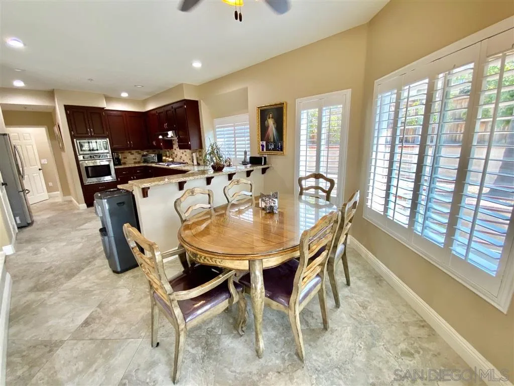 1988 Monarch Ridge Circle El Cajon, CA 92019 - Photo 6 of 27 a dining room with furniture and a floor to ceiling window