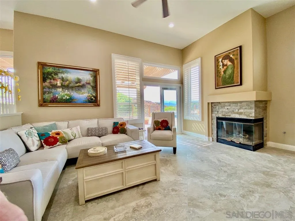 1988 Monarch Ridge Circle El Cajon, CA 92019 - Photo 7 of 27 a living room with furniture and a fireplace