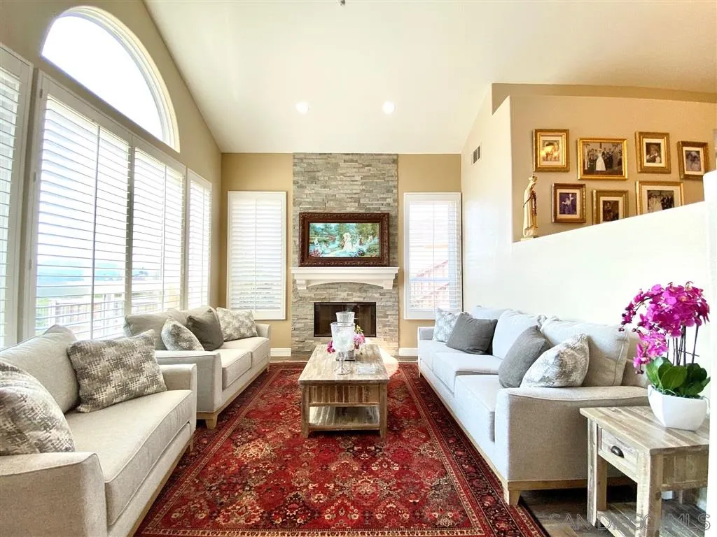 1988 Monarch Ridge Circle El Cajon, CA 92019 - Photo 9 of 27 a living room with furniture fireplace and window
