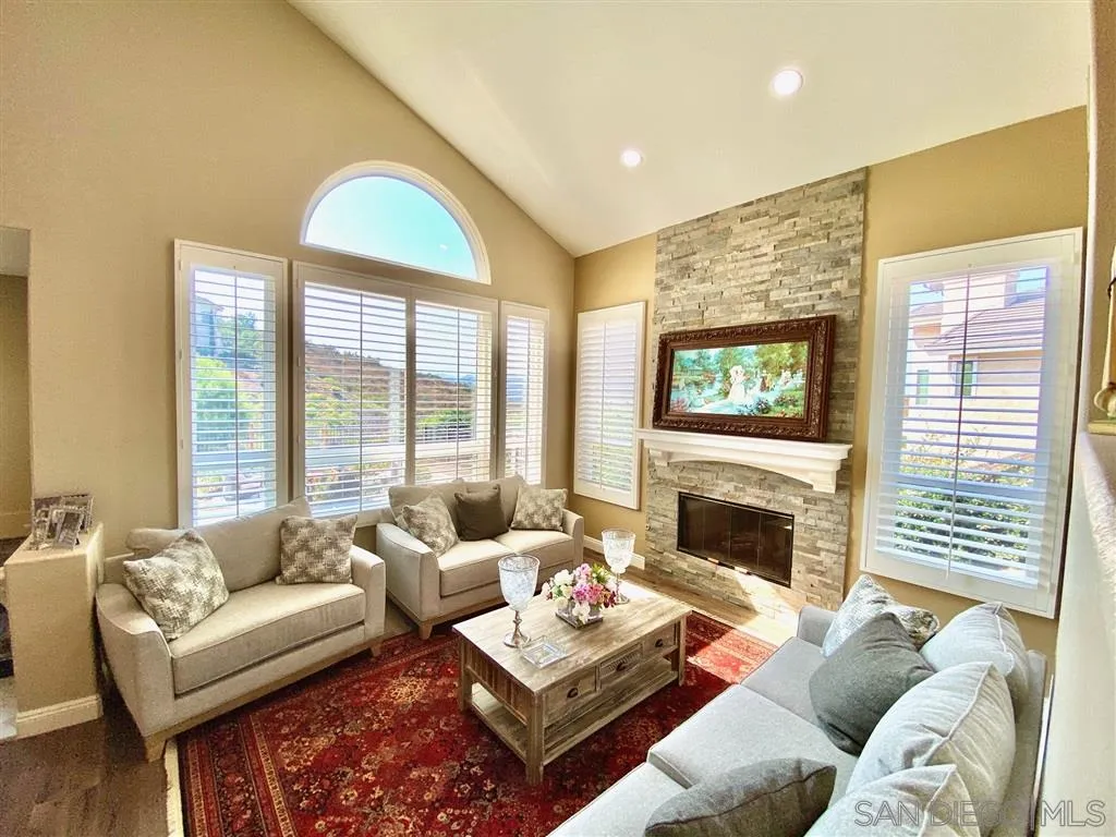 1988 Monarch Ridge Circle El Cajon, CA 92019 - Photo 10 of 27 a living room with furniture fireplace and a large window