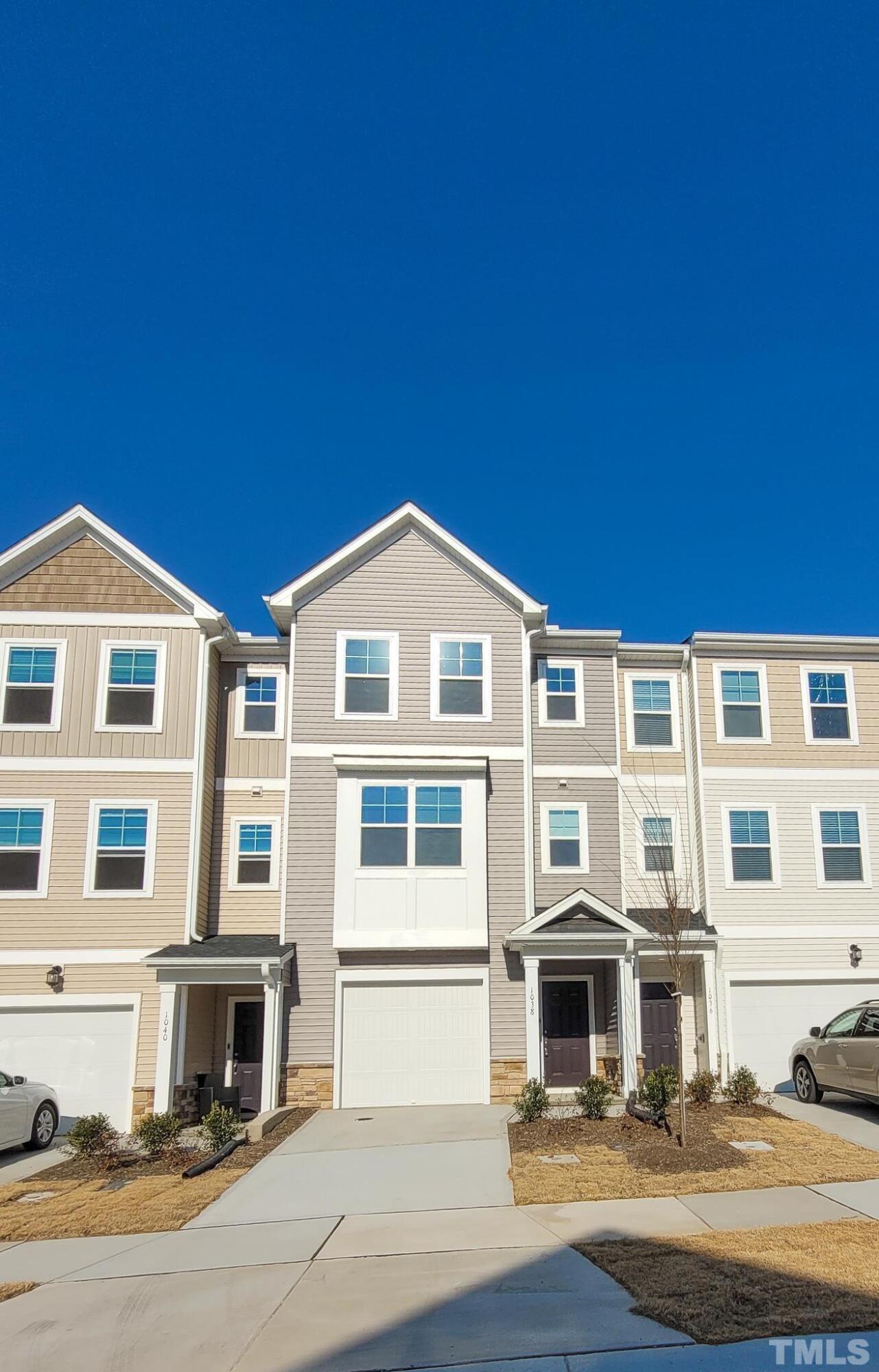 1038 Shoreside Drive Durham, NC 27713 - Photo 1 of 42 a front view of residential houses with yard