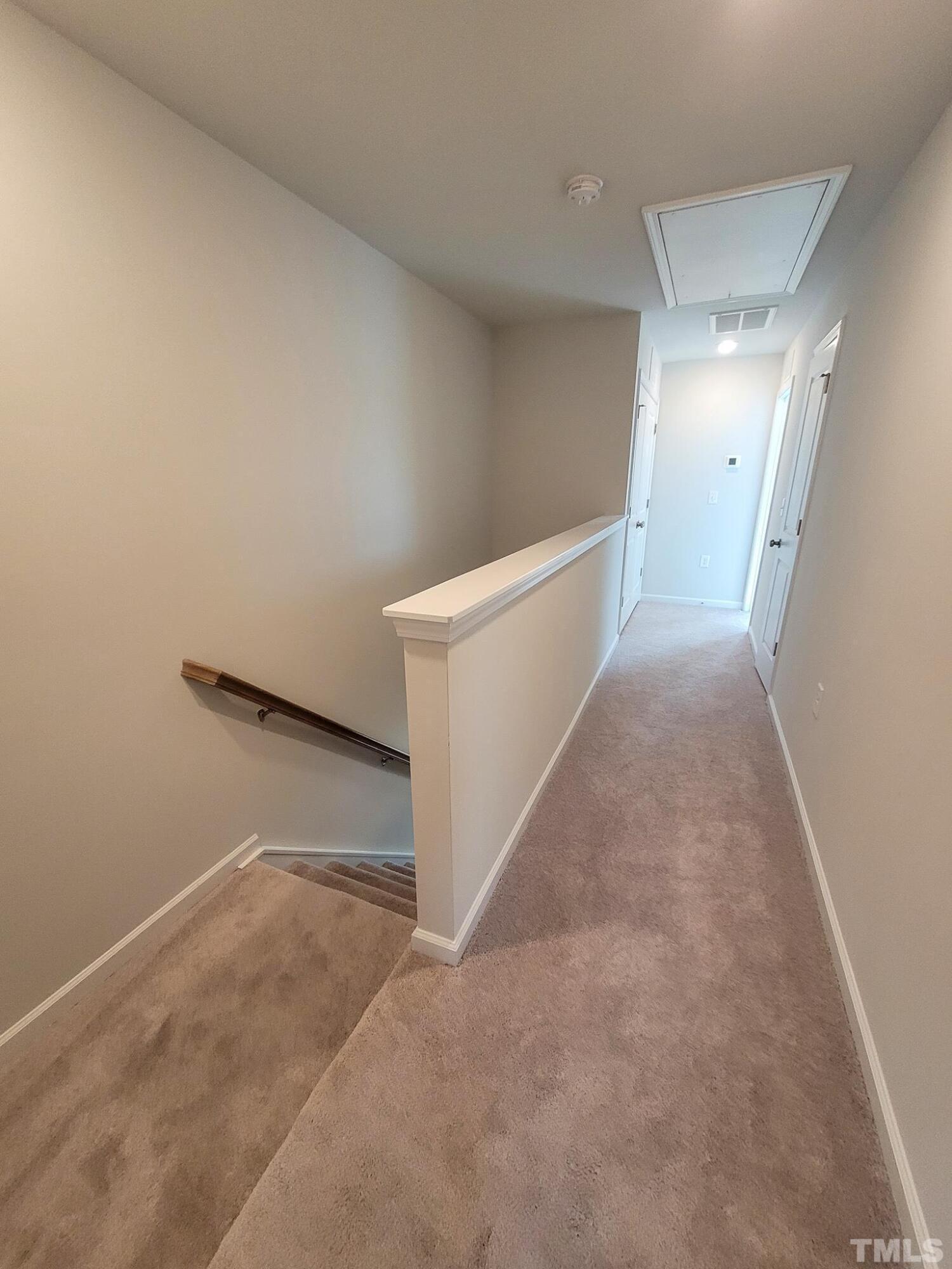1038 Shoreside Drive Durham, NC 27713 - Photo 23 of 42 a view of a hallway with staircase