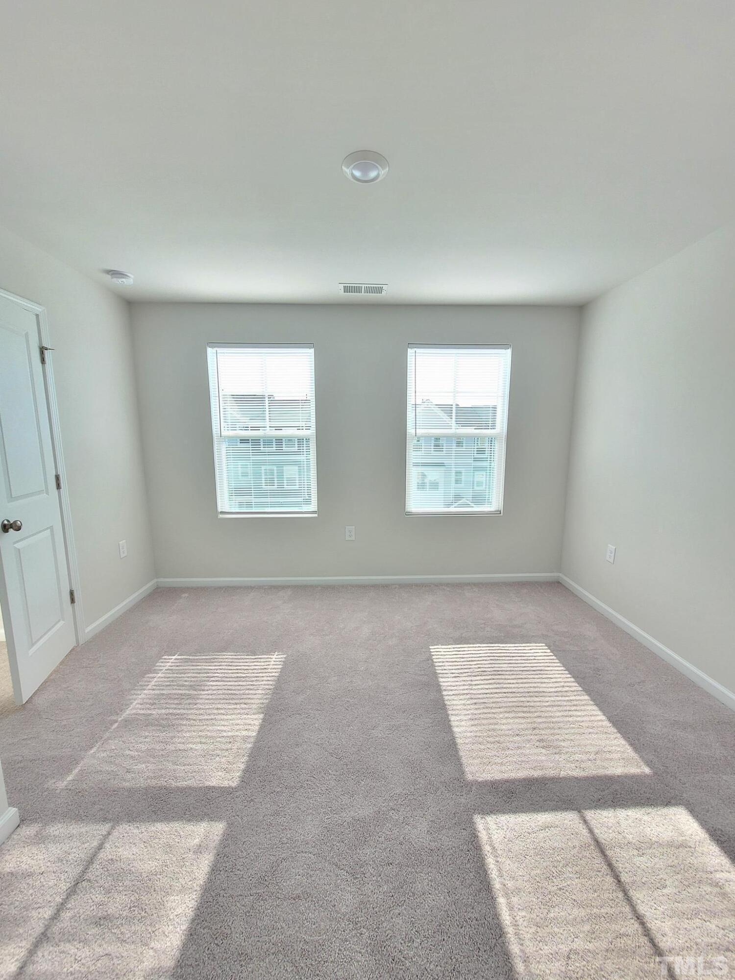 1038 Shoreside Drive Durham, NC 27713 - Photo 24 of 42 an empty room with windows