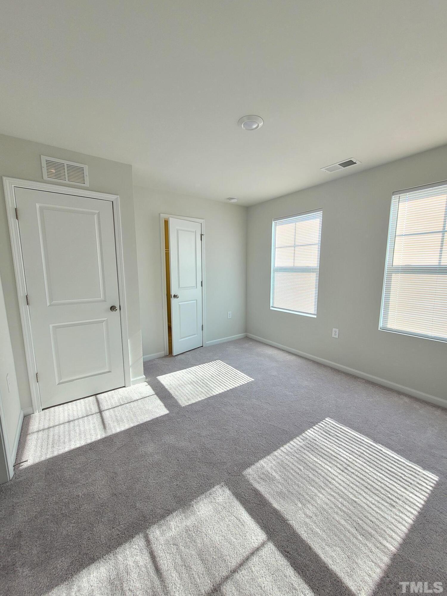 1038 Shoreside Drive Durham, NC 27713 - Photo 25 of 42 a view of an empty room with a window