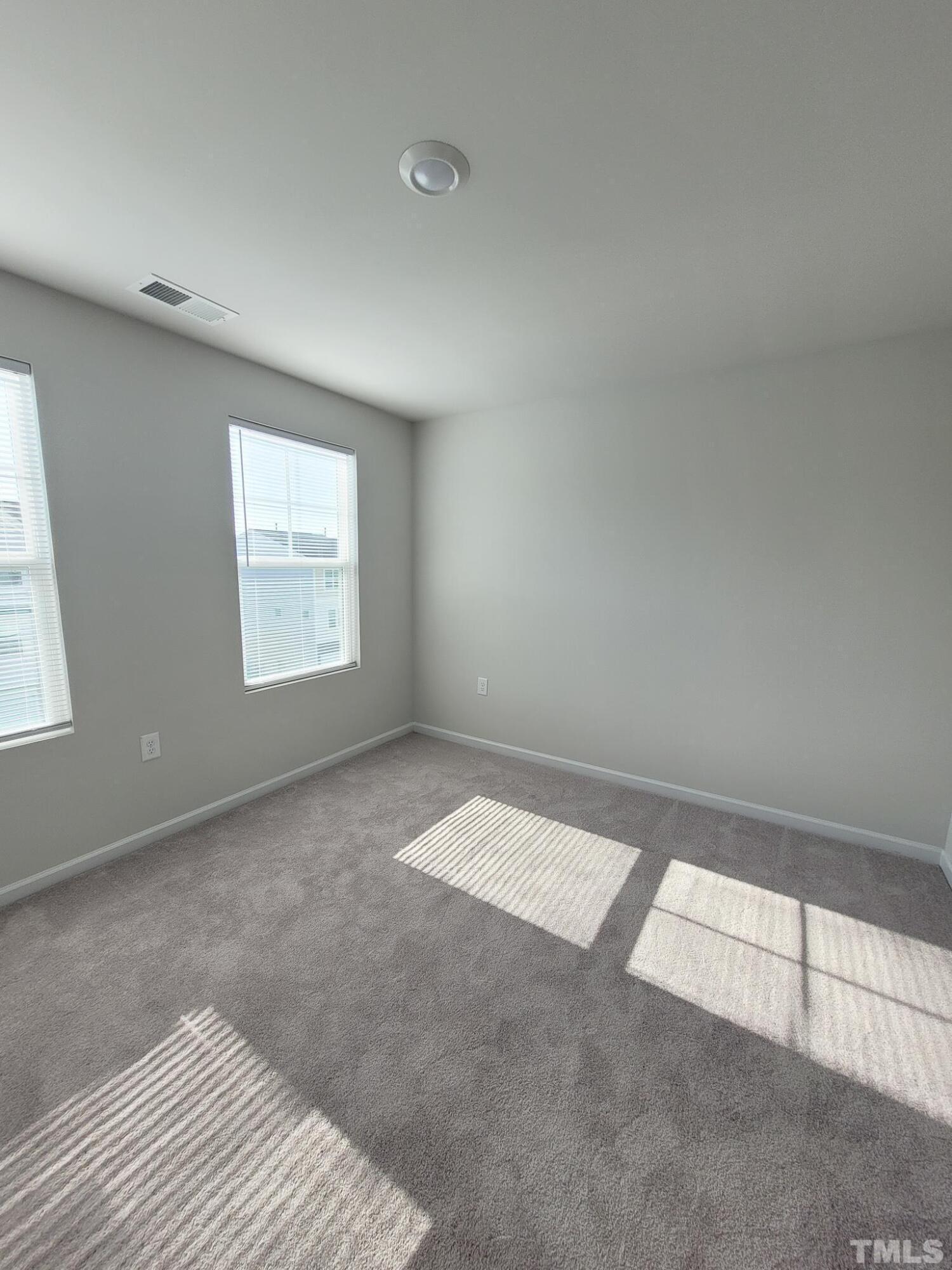 1038 Shoreside Drive Durham, NC 27713 - Photo 26 of 42 an empty room with windows