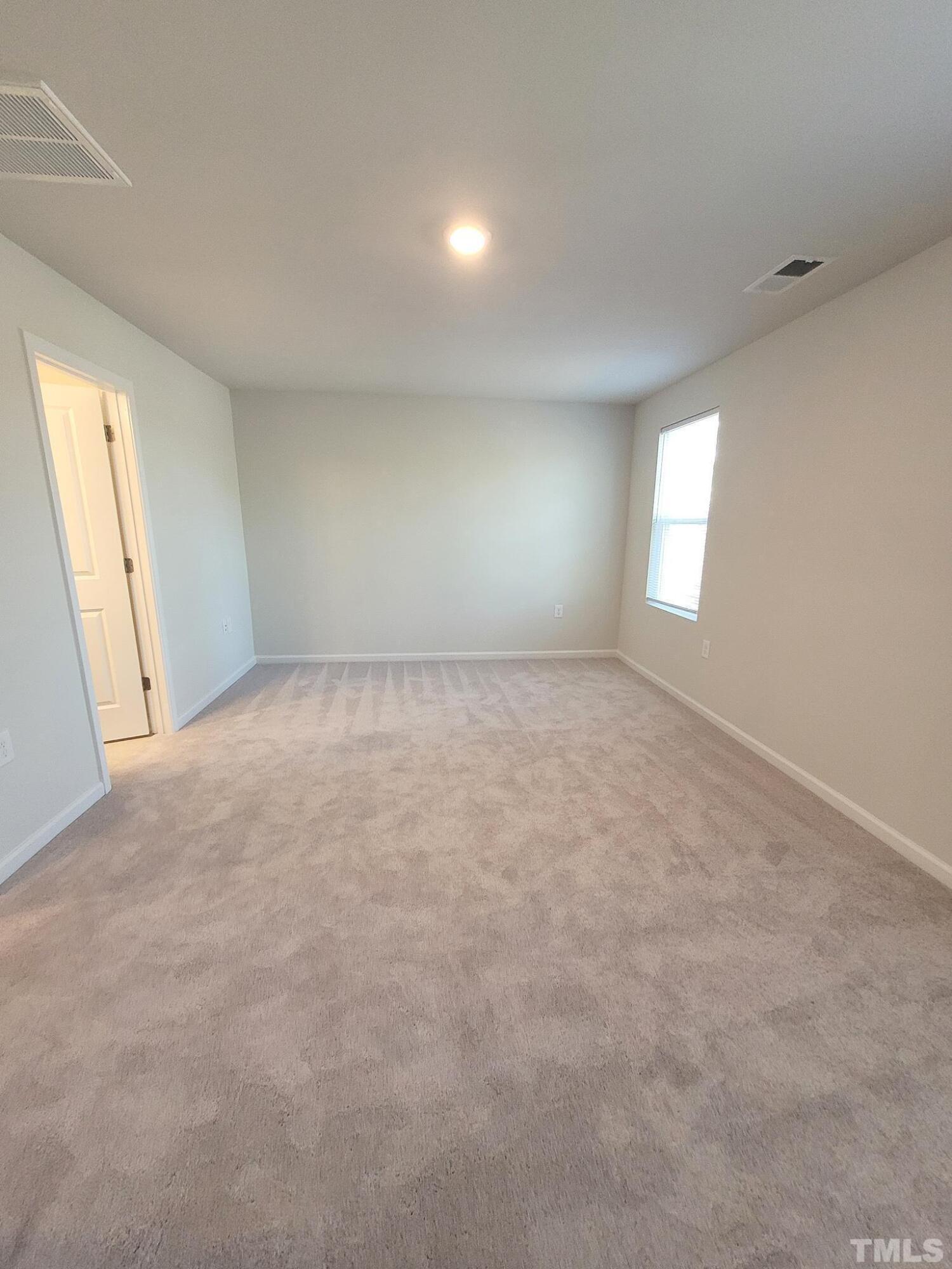 1038 Shoreside Drive Durham, NC 27713 - Photo 33 of 42 an empty room with windows
