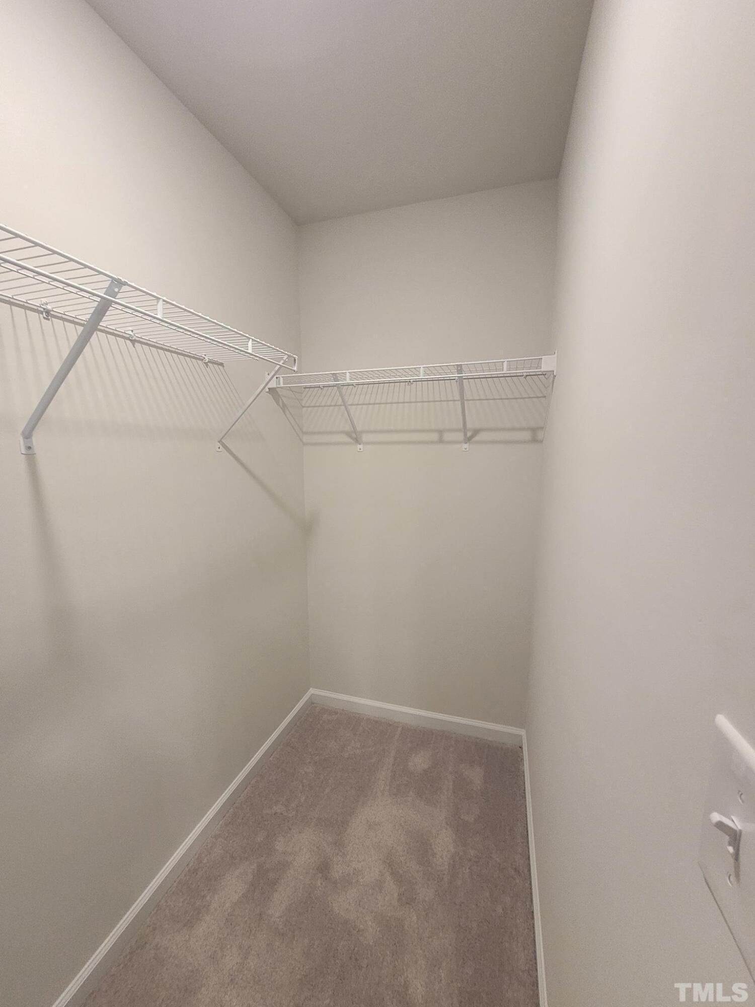 1038 Shoreside Drive Durham, NC 27713 - Photo 36 of 42 a view of a room with racks on the wall