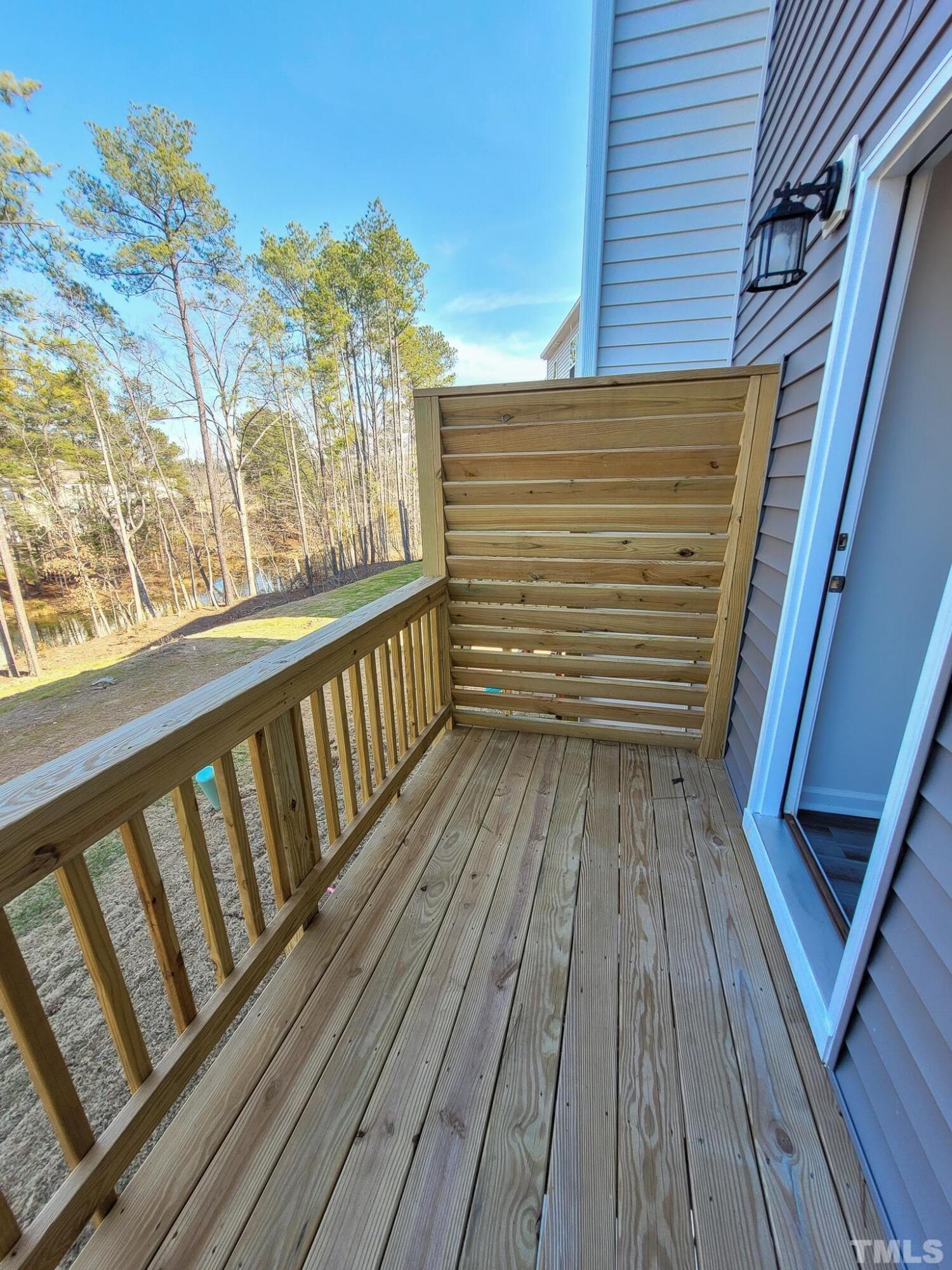 1038 Shoreside Drive Durham, NC 27713 - Photo 40 of 42 a view of a balcony with wooden floor and fence