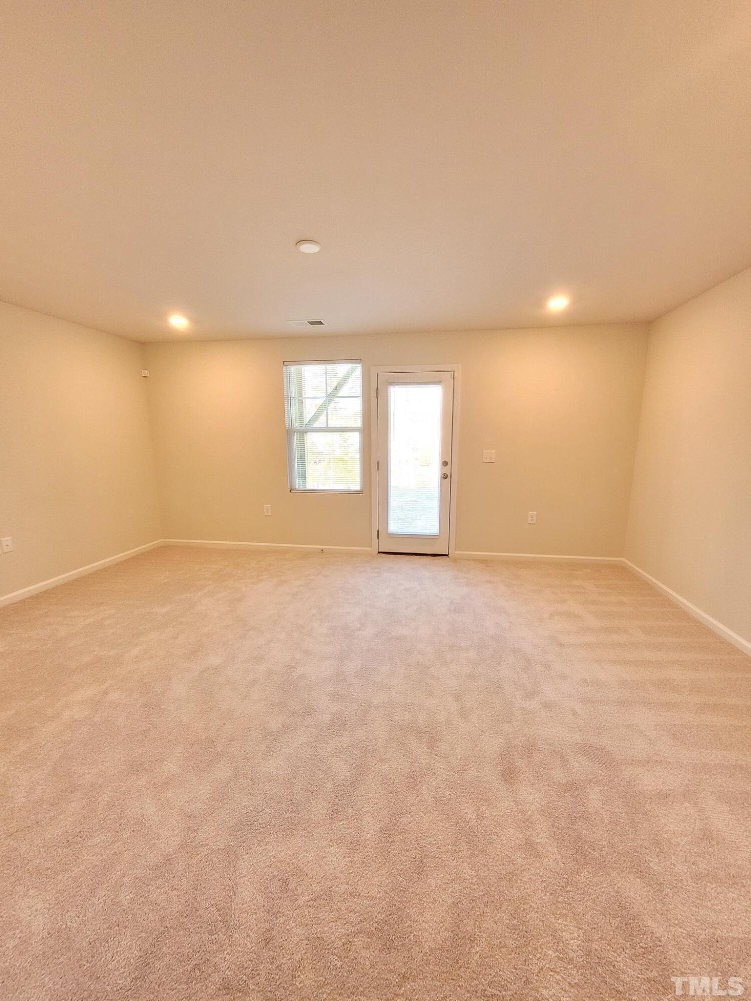 1038 Shoreside Drive Durham, NC 27713 - Photo 4 of 42 an empty room with windows and closet