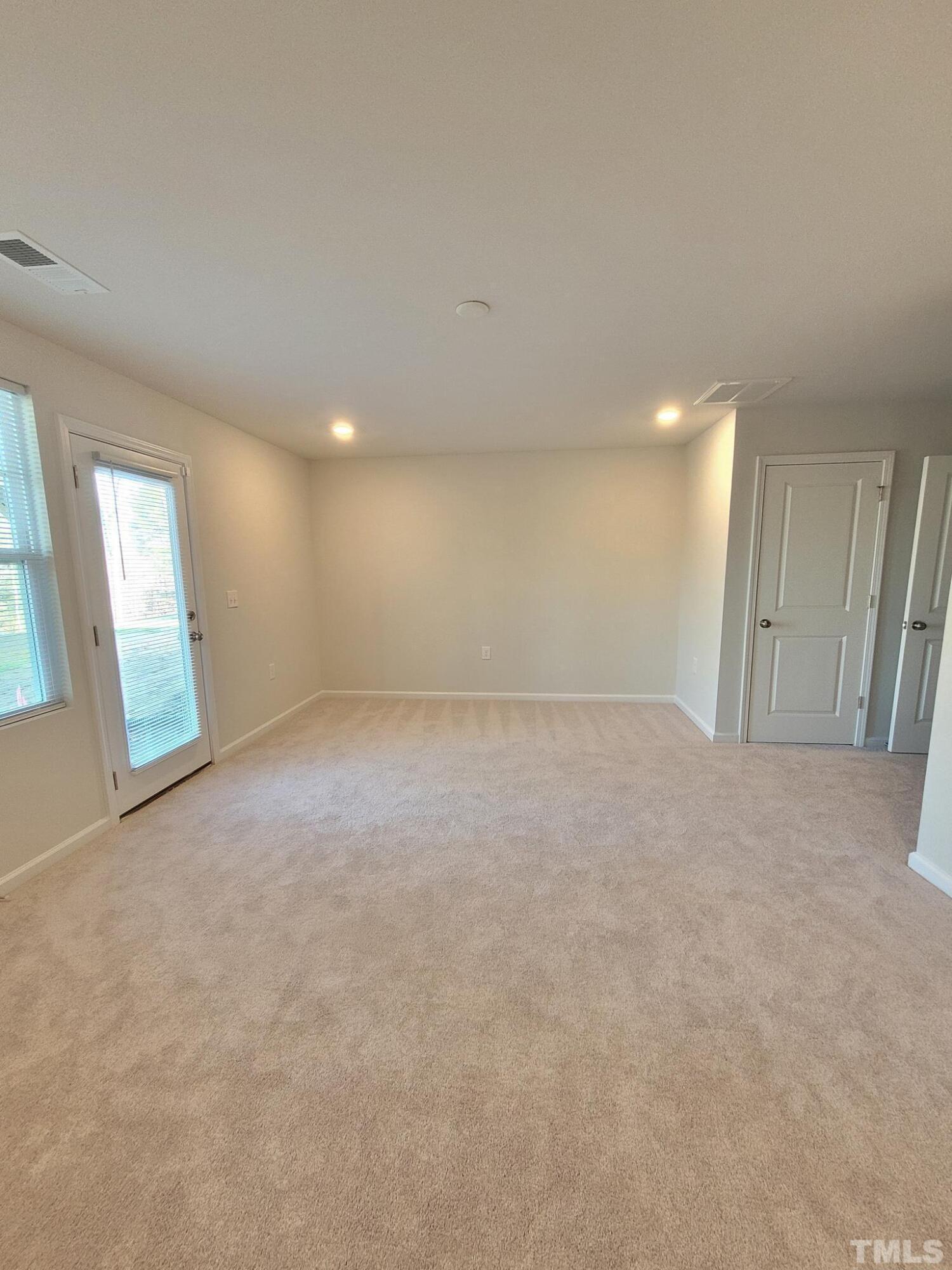 1038 Shoreside Drive Durham, NC 27713 - Photo 6 of 42 a view of an empty room with a window