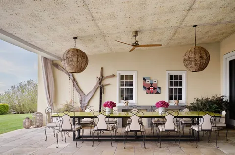 a very nice looking room with a table and a clock