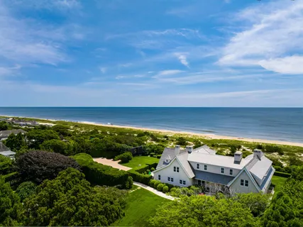 an aerial view of a house with a garden