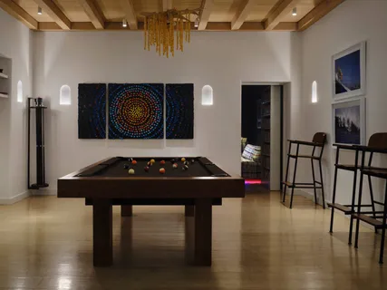 a kitchen with a table and chairs