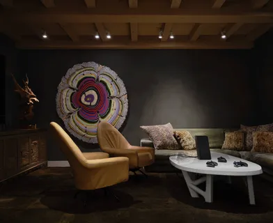 a living room with furniture and a lamp