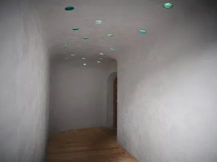 a view of hallway with wooden floor