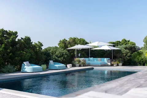 swimming pool view with a seating space