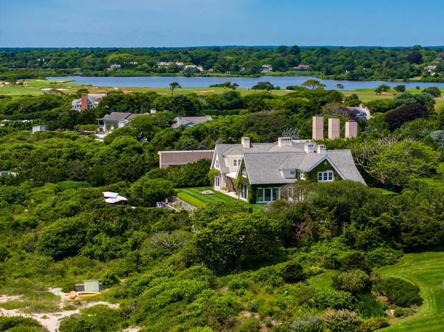 a view of lake and houses with outdoor space