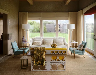 a bed room with a bed and a chair