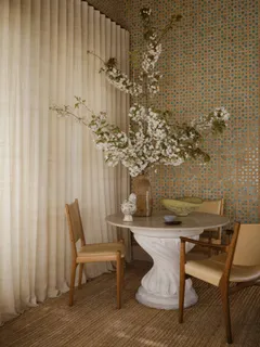 a view of a room with furniture and wooden floor