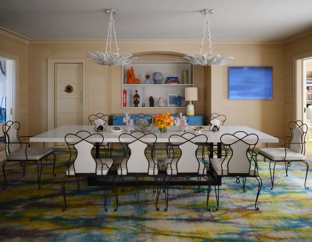 a living room with lots of furniture and chandelier