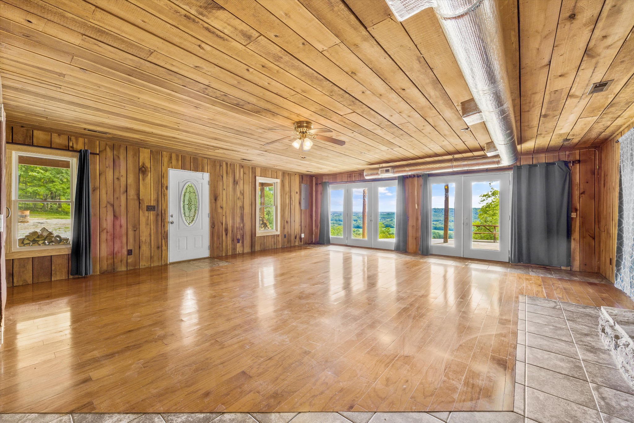 195 Curtis Road Fayetteville, TN 37334 - Photo 12 of 45 a view of an empty room with wooden floor and a window