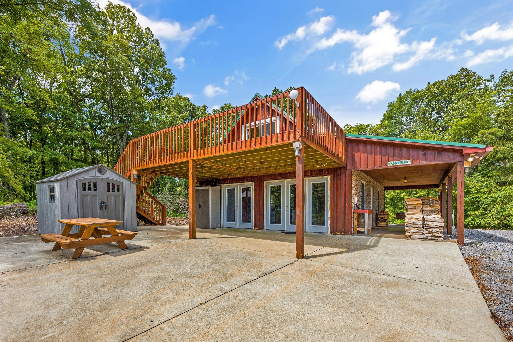 195 Curtis Road Fayetteville, TN 37334 - Photo 5 of 45 a view of a house with large windows and a small yard