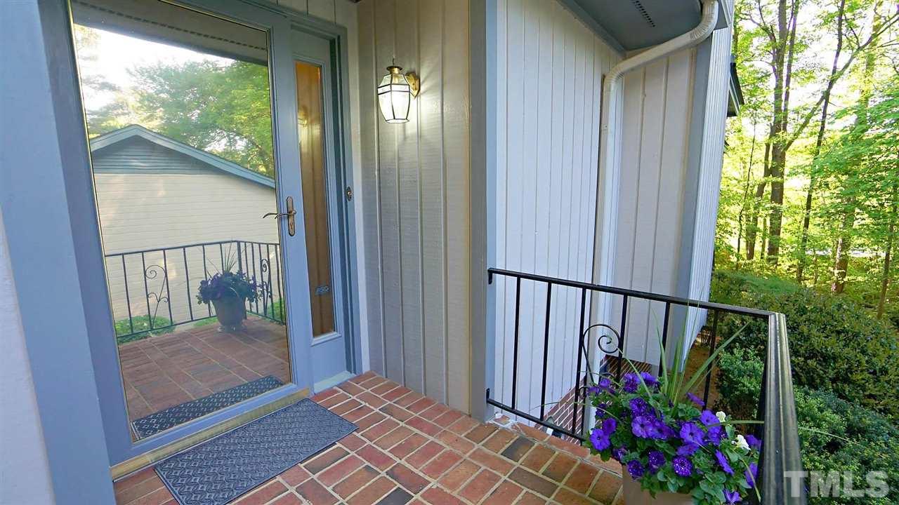 2801 Rue Sans Famille Raleigh, NC 27607 - Photo 3 of 26 Freshly painted doorway with glass storm door that locks for added protection. Also allows for light to come in during the day.