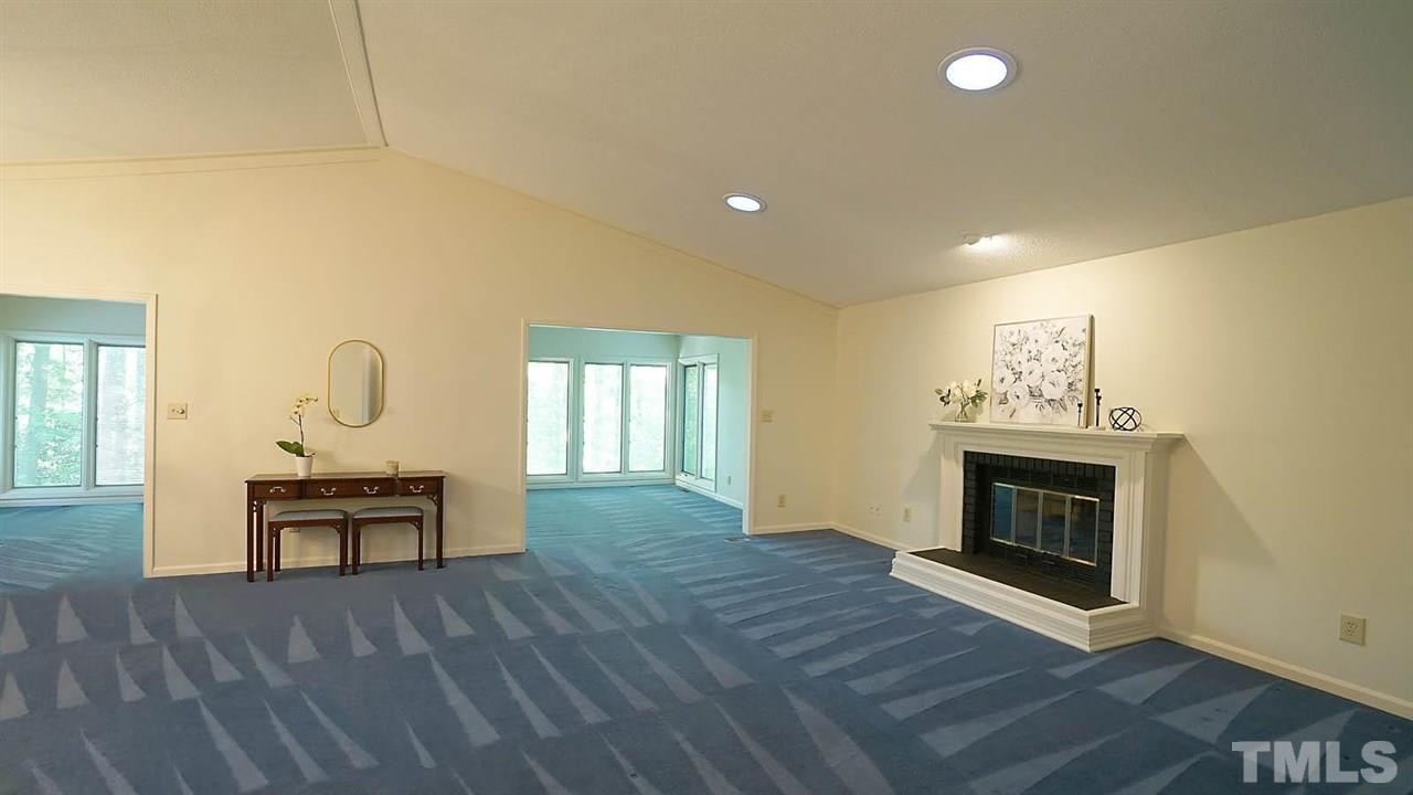2801 Rue Sans Famille Raleigh, NC 27607 - Photo 4 of 26 Foyer view into living/dining/sunroom. Lots of space to create many room configurations