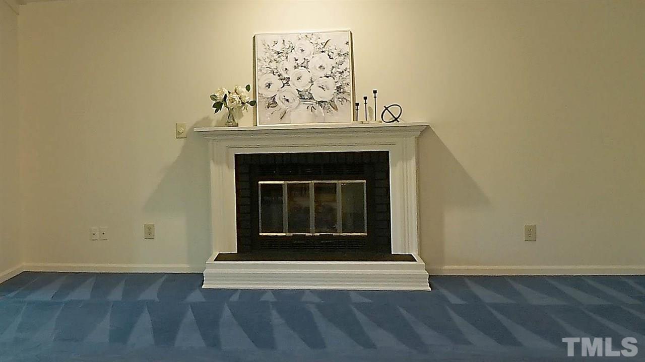 2801 Rue Sans Famille Raleigh, NC 27607 - Photo 5 of 26 Remodeled gas fireplace with new gas logs, shutoff and gas line. Ready to curl up around in the cold winters.