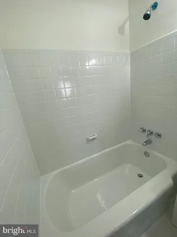a close view of a bathtub in bathroom