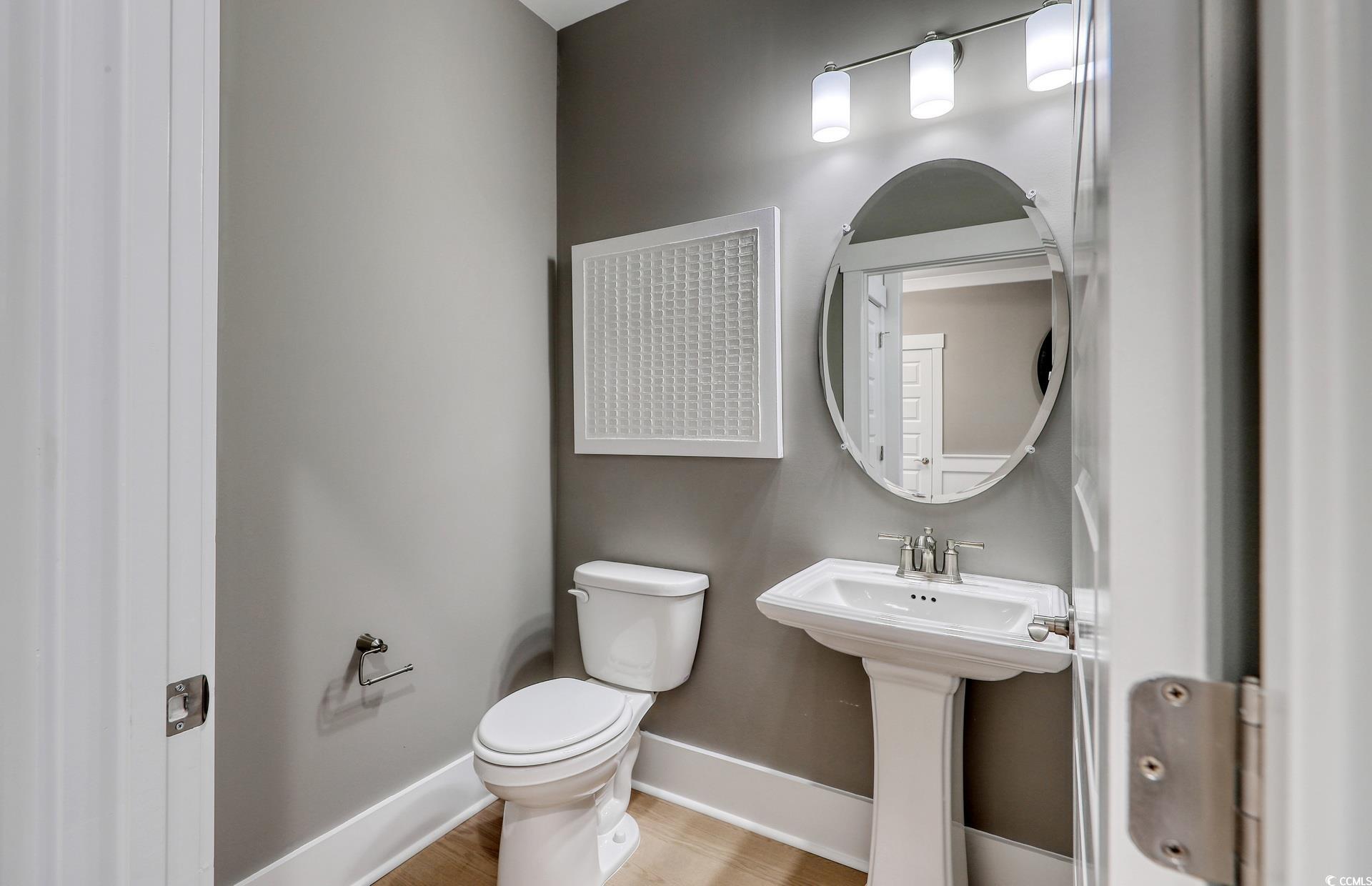 1514 Winding Crk Way Myrtle Beach, SC 29588 - Photo 2 of 20 Bathroom featuring toilet and light wood-style floors