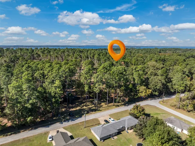 a view of a yard with swimming pool