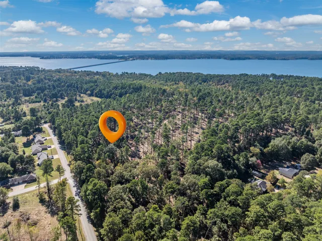 a view of a yard with a swimming pool and outdoor seating