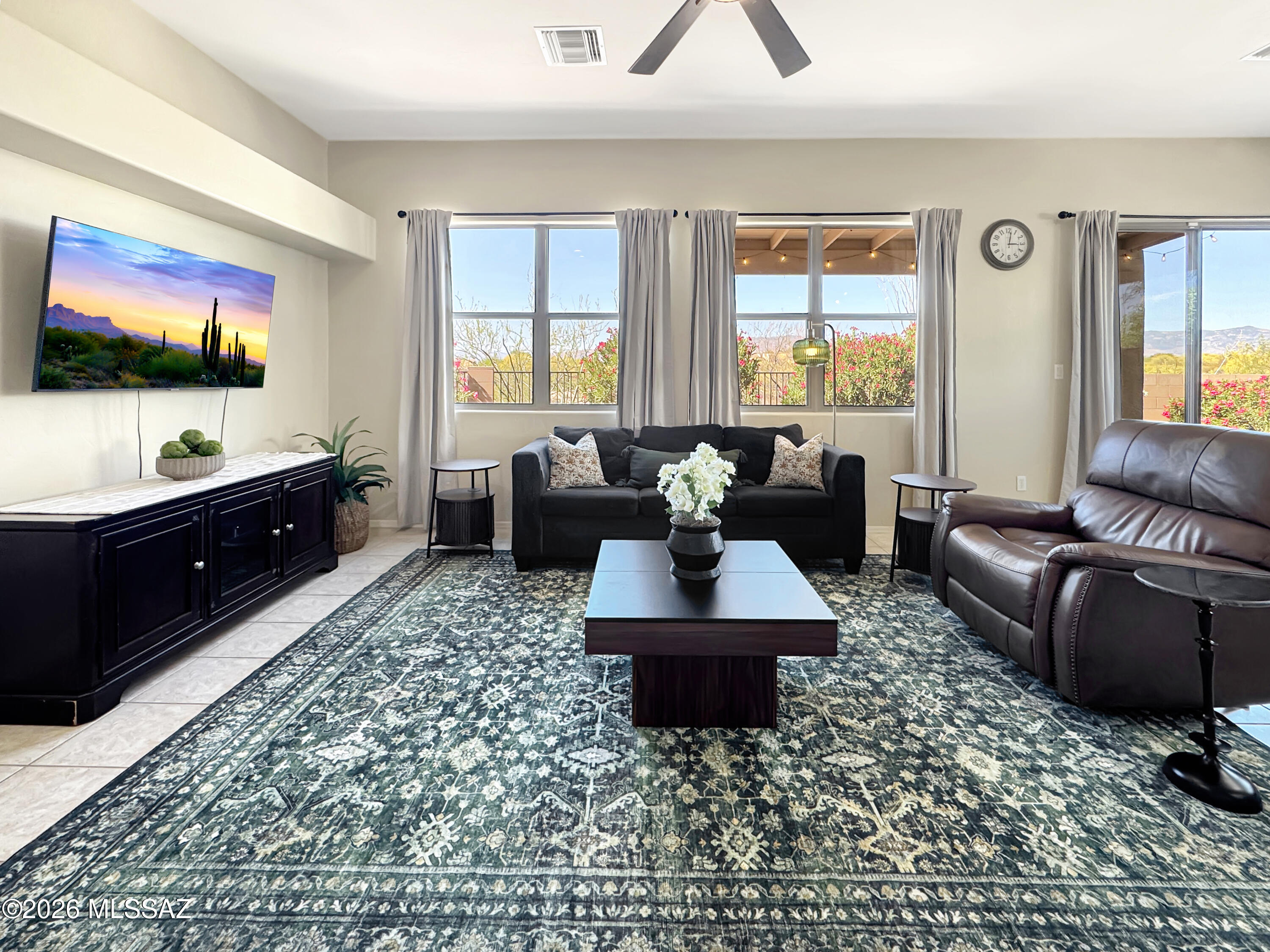 10835 South Heart Break Ridge Place Vail, AZ 85641 - Photo 13 of 49 a living room with furniture and a flat screen tv