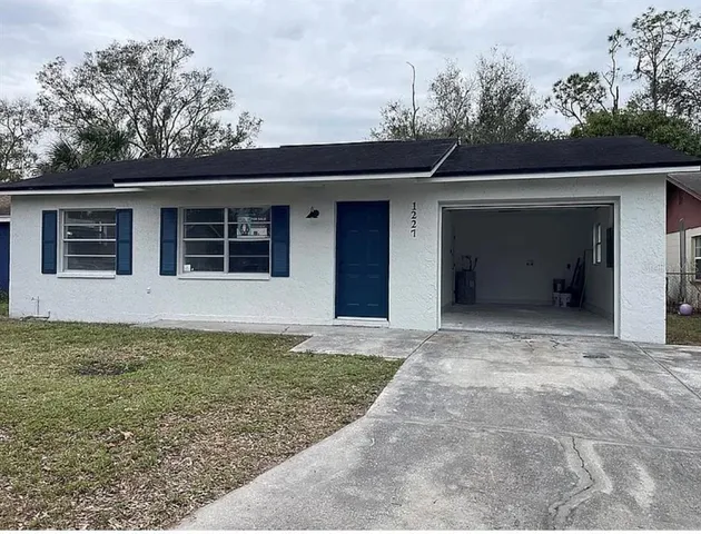 a view of a house with a garage
