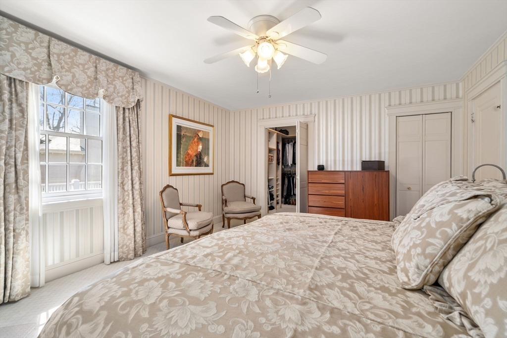 41 Nobscot Road Newton, MA 02459 - Photo 24 of 37 a bedroom with a bed and dresser with mirror