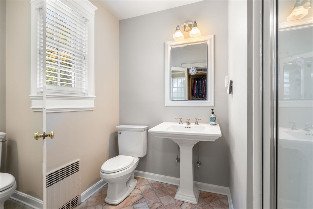 41 Nobscot Road Newton, MA 02459 - Photo 26 of 37 a bathroom with a toilet sink and mirror