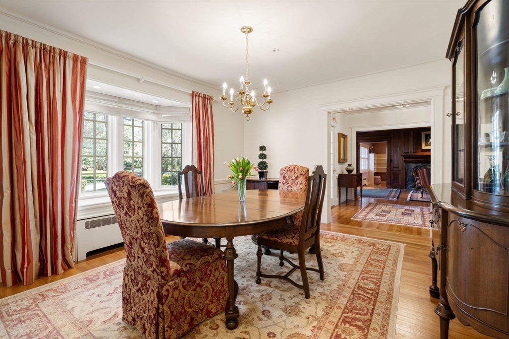 41 Nobscot Road Newton, MA 02459 - Photo 7 of 37 a view of a dining room with furniture and a chandelier