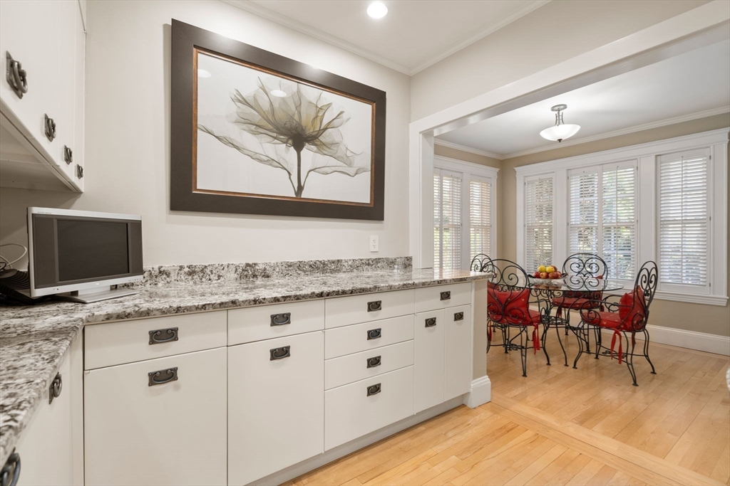 41 Nobscot Road Newton, MA 02459 - Photo 10 of 37 a spacious bathroom with a granite countertop sink a large mirror and a window