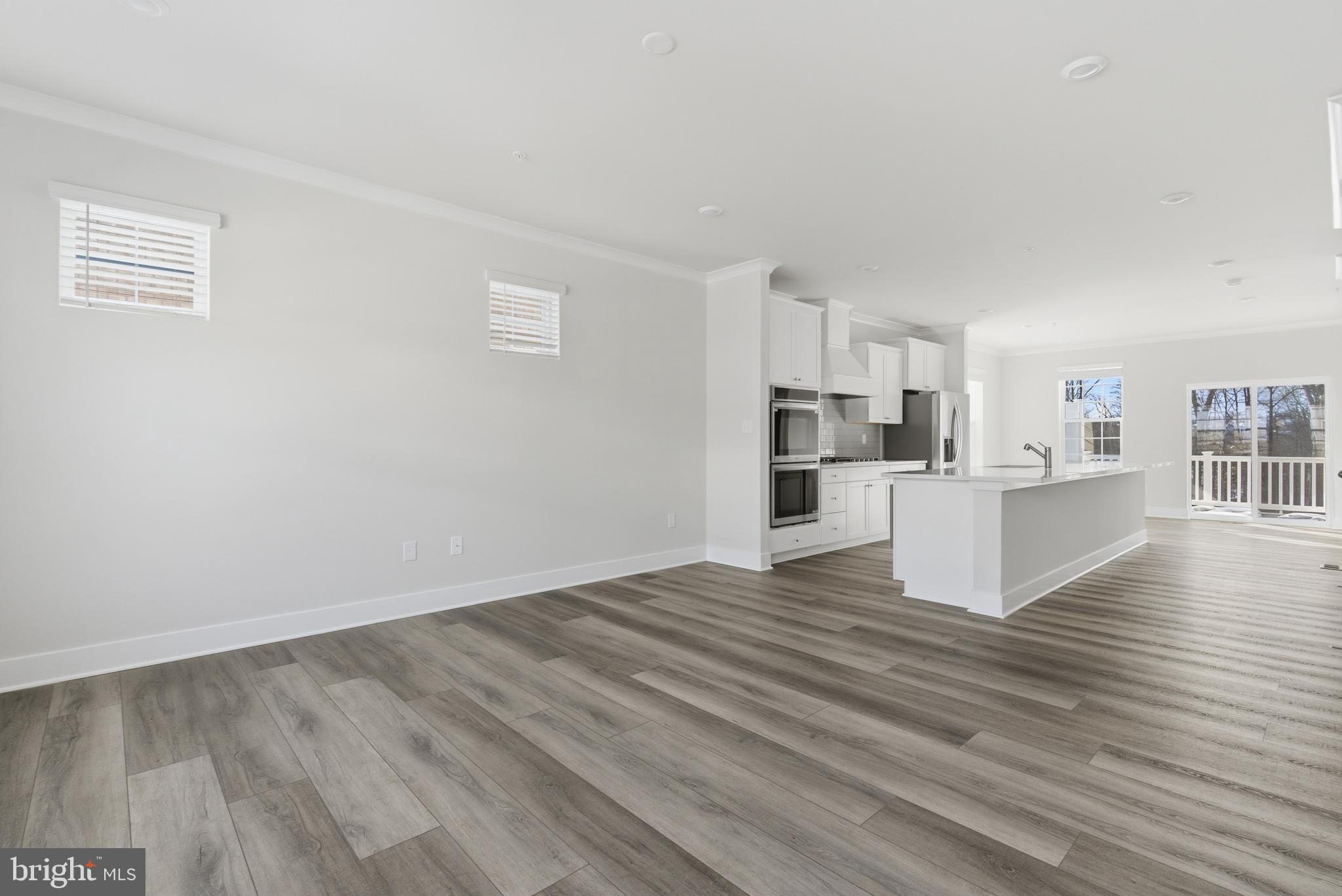 1722 Water Xing Road Baltimore, MD 21208 - Photo 15 of 41 a view of a kitchen with wooden floor and a sink