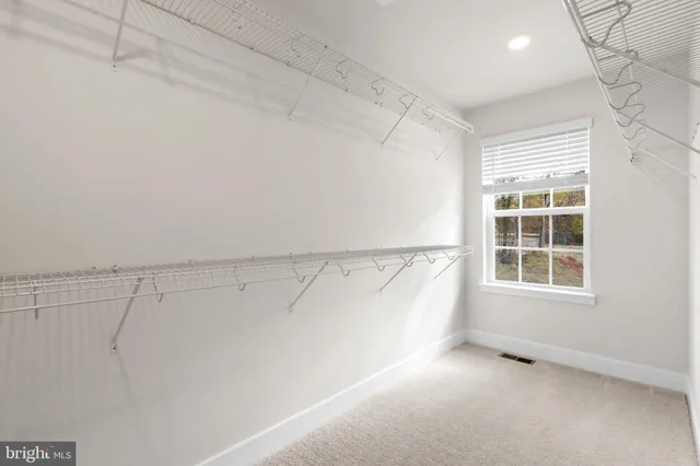 a view of a room with racks on the wall