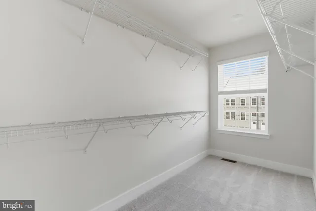 a view of a small space with racks on the wall