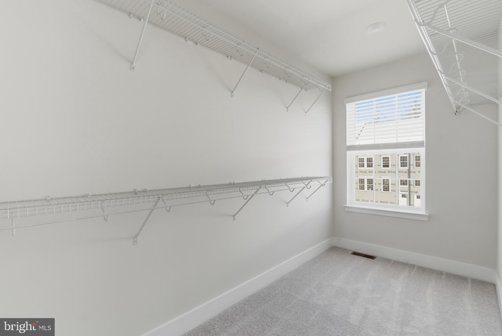 1722 Water Xing Road Baltimore, MD 21208 - Photo 23 of 41 a view of a small space with racks on the wall