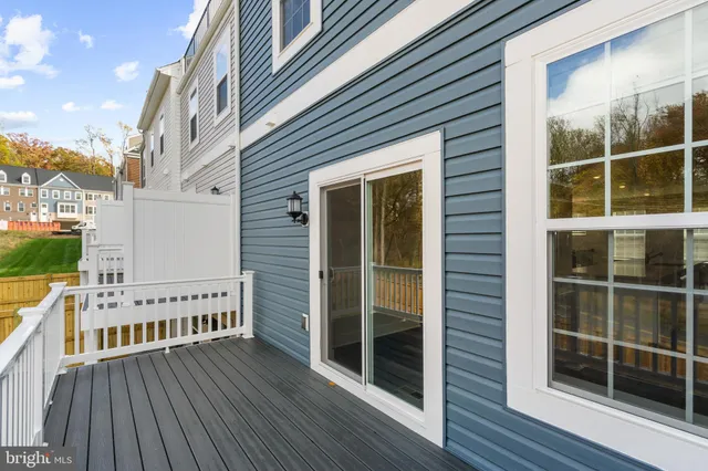 a view of a balcony with wooden floor