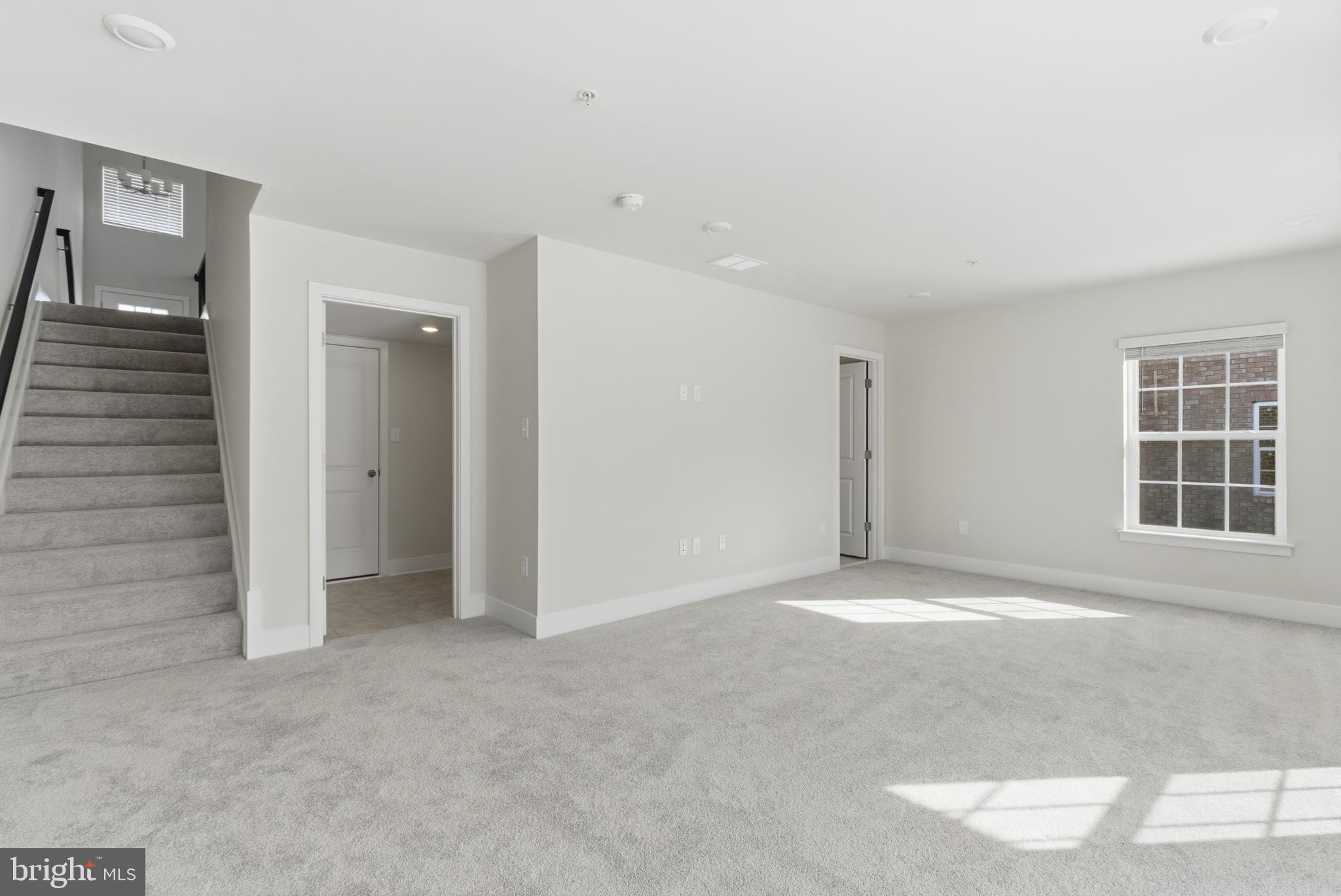 1722 Water Xing Road Baltimore, MD 21208 - Photo 33 of 41 an empty room with windows and cabinet