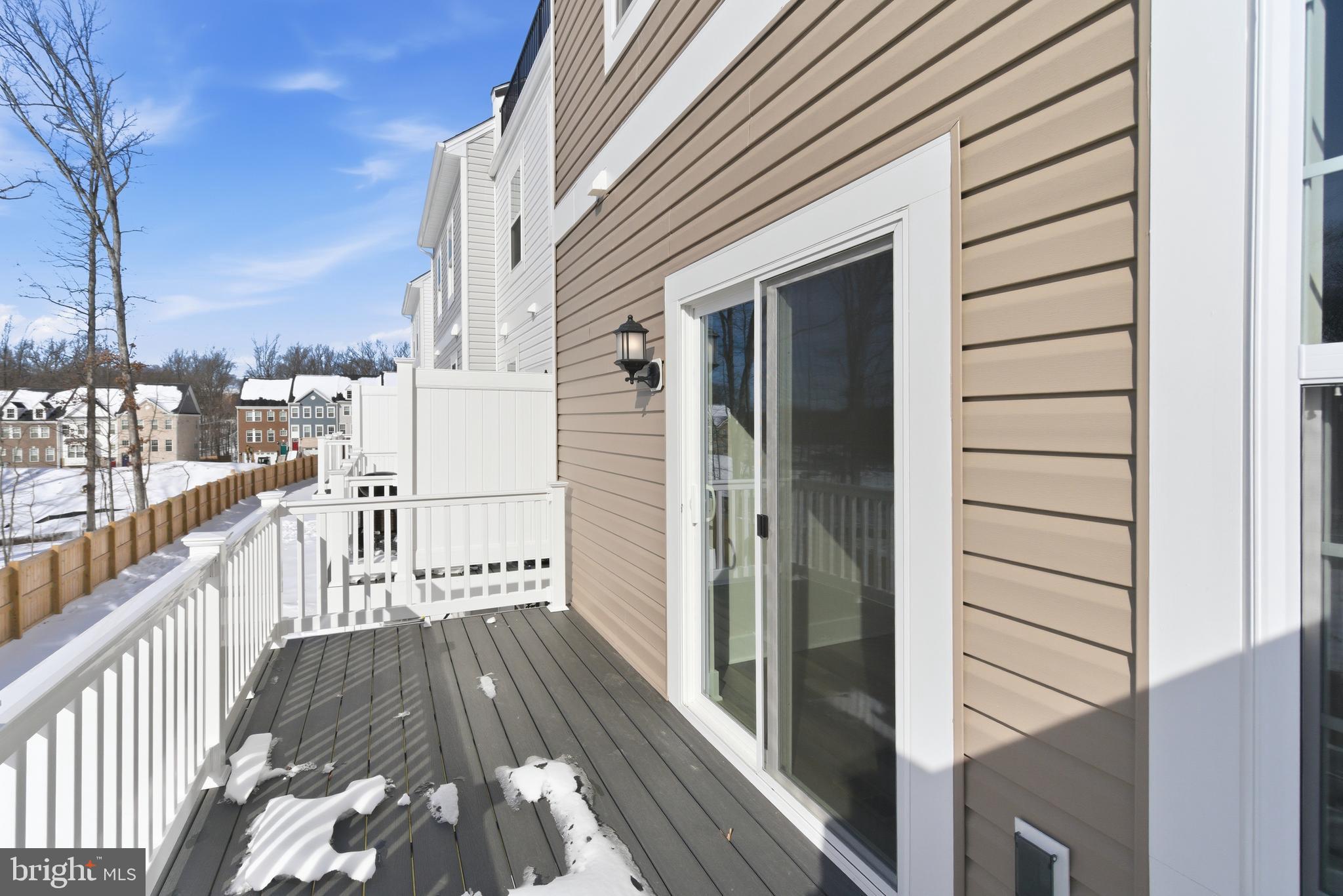 1722 Water Xing Road Baltimore, MD 21208 - Photo 36 of 41 a view of a balcony with wooden floor and fence