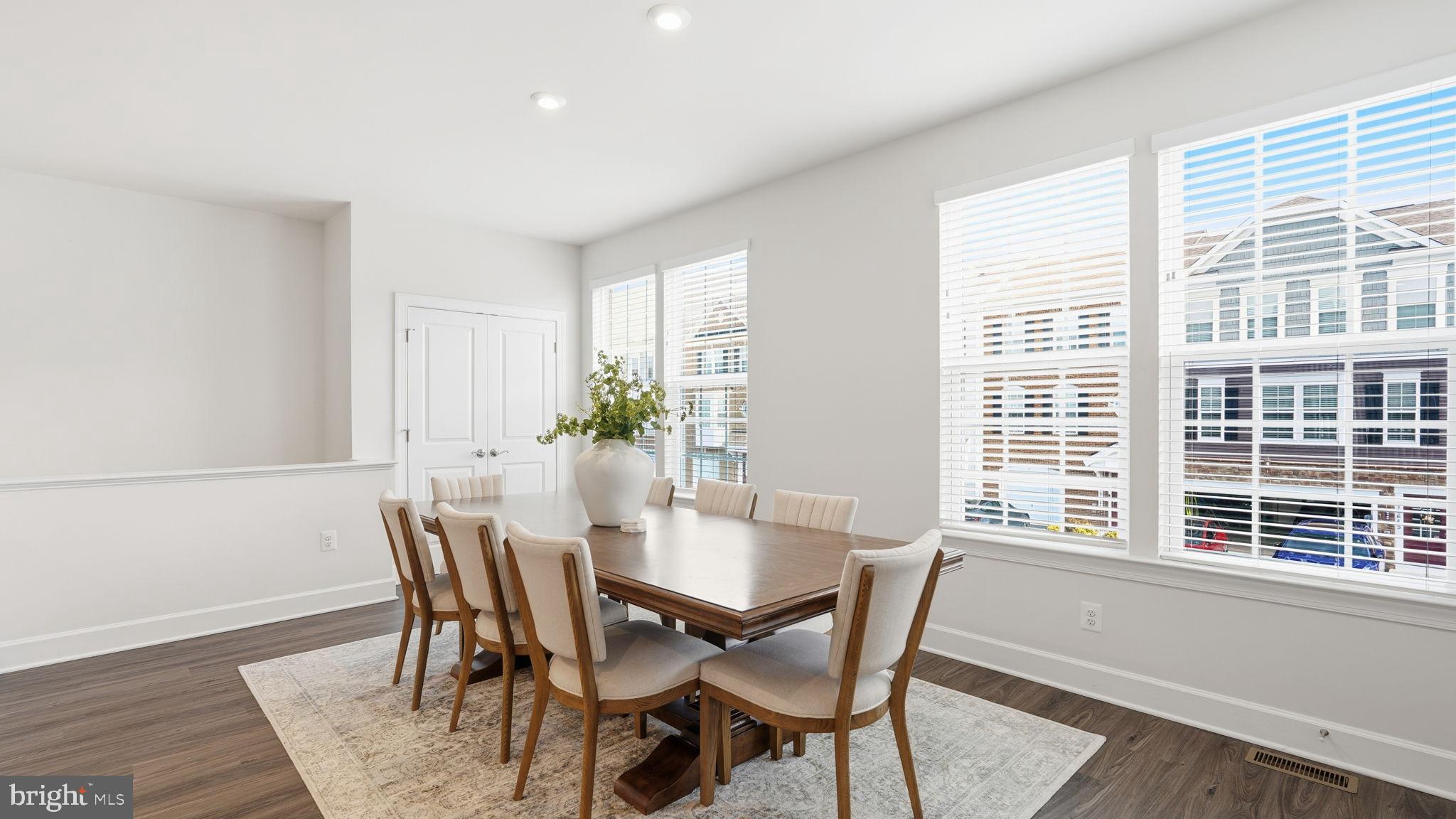 10644 Hinton Way Manassas, VA 20112 - Photo 15 of 44 a view of a dining room with furniture and windows